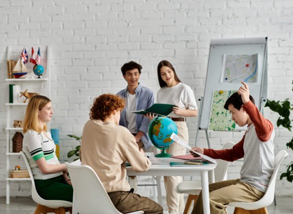 A group of teenagers engage in a lively discussion during a United Nations model session.
